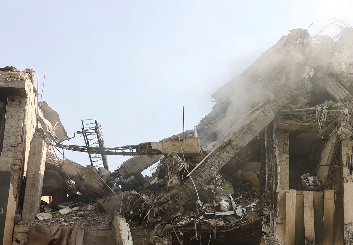<i>Majid Asgaripour/Wana News Agency/Reuters via CNN Newsource</i><br/>Smoke rises from a damaged building in the aftermath of Israeli strikes in Tehran on June 13