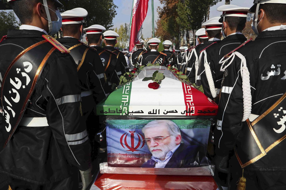 <i>Iranian Defense Ministry/AP via CNN Newsource</i><br/>Military personnel stand near the flag-draped coffin of Mohsen Fakhrizadeh during his funeral in Tehran
