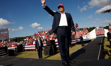 Donald Trump walks offstage after giving remarks at a rally at Greenbrier Farms in June 2024