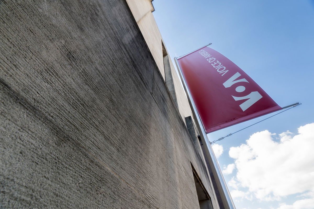 <i>J. David Ake/Getty Images via CNN Newsource</i><br/>A banner hangs on the side of the Voice of America (VOA) headquarters building in Washington