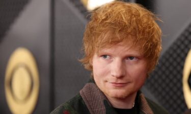 Ed Sheeran poses on the red carpet as he attends the 66th Annual Grammy Awards in Los Angeles