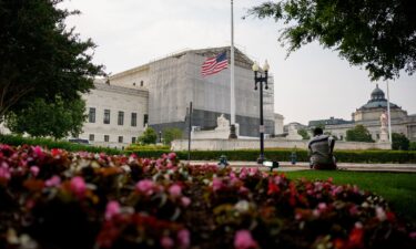 A person rests in front of the U.S. Supreme Court on June 5