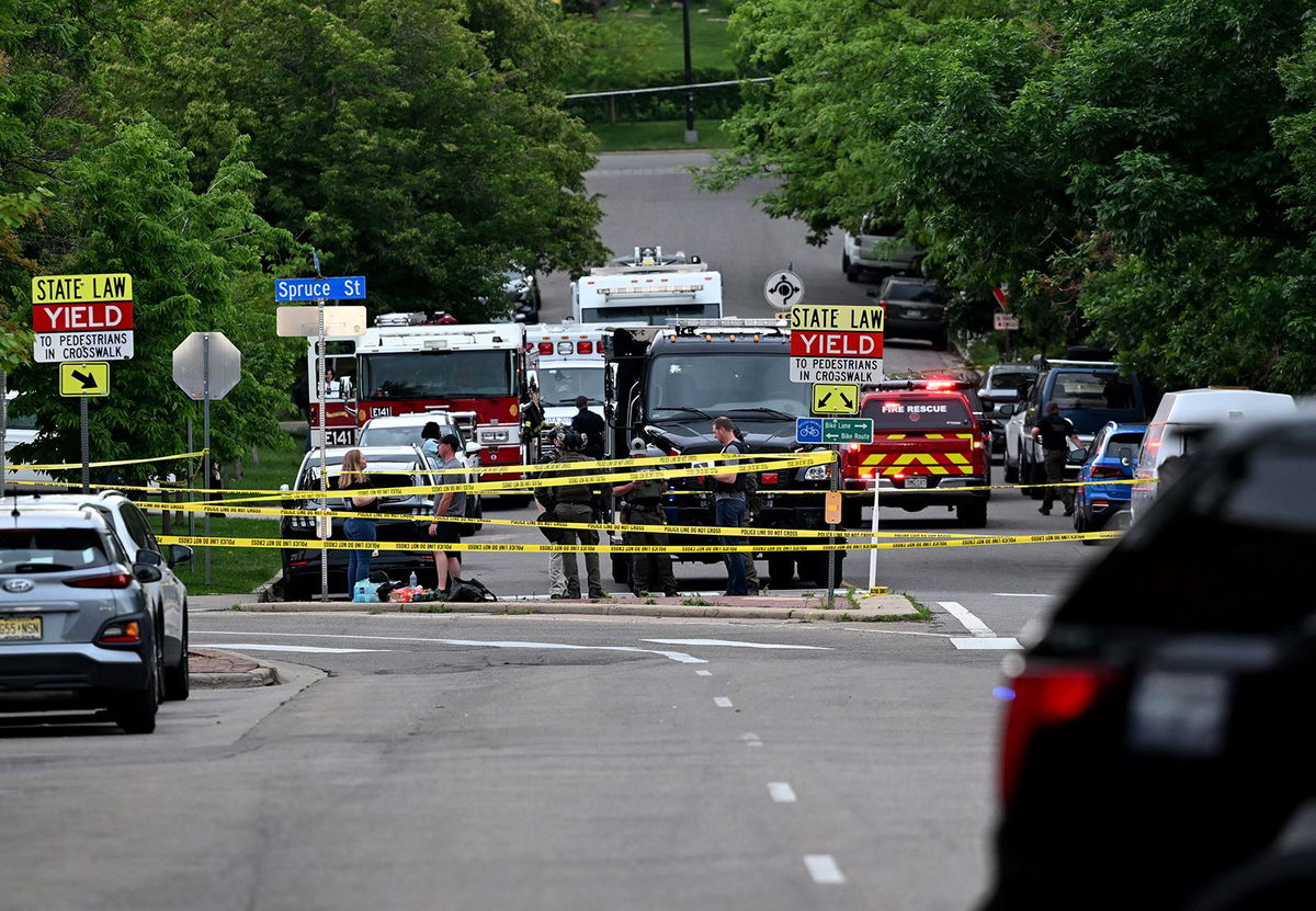 <i>OpusObscura/X/Reuters via CNN Newsource</i><br/>Law enforcement officers detain Mohamed Sabry Soliman after an attack in Boulder