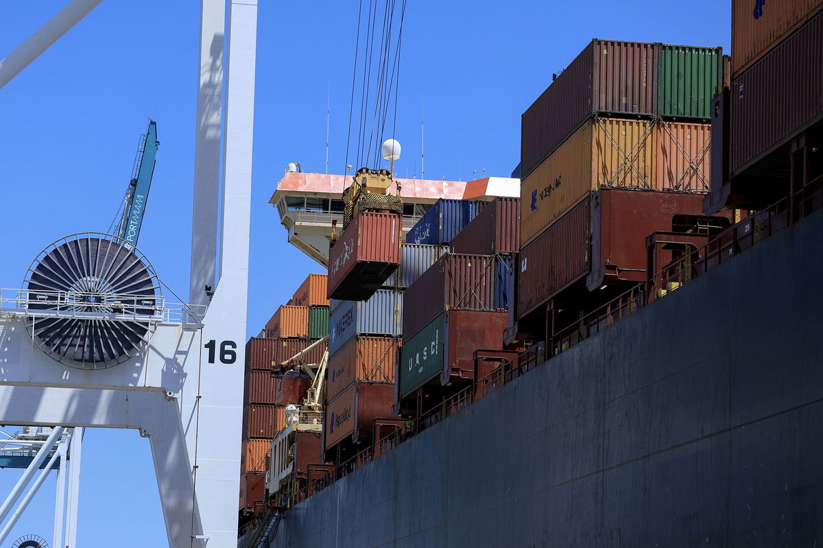 <i>Joe Raedle/Getty Images via CNN Newsource</i><br/>Shipping containers are stacked on a cargo ship as they are offloaded at PortMiami on April 15 in Miami
