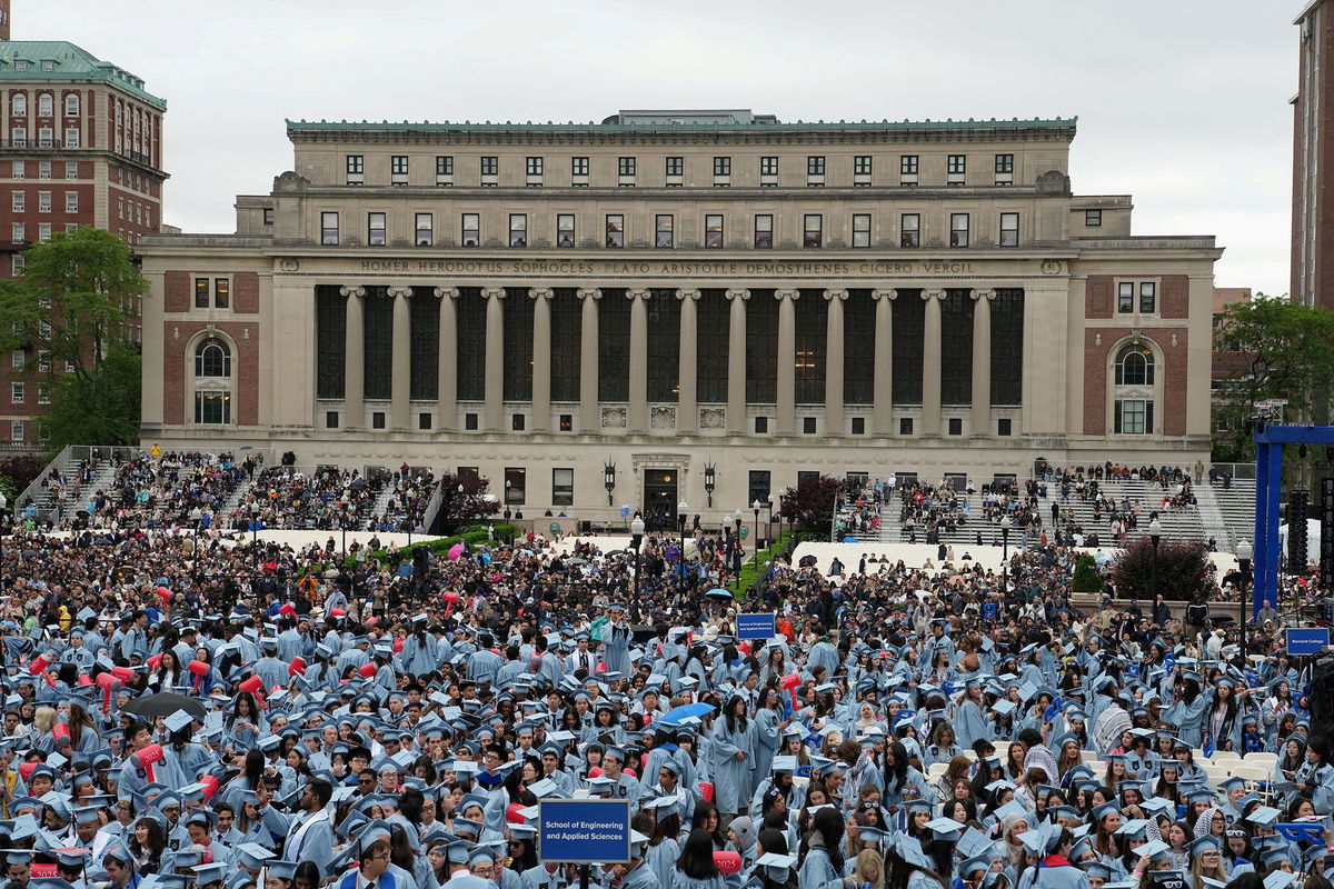 <i>Juan Arredondo/Pool/Reuters/File via CNN Newsource</i><br/>Students attend the Commencement Ceremony at Columbia University in New York on May 21.