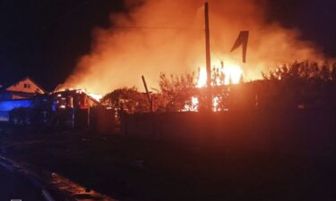 A firefighter attends a site of a drone attack in Pryluky
