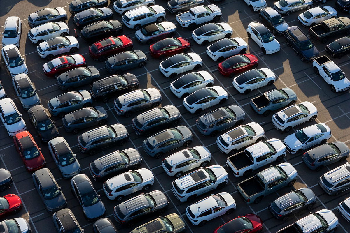 <i>Kevin Carter/Getty Images via CNN Newsource</i><br/>New vehicles are parked at the National City Marine Terminal in California