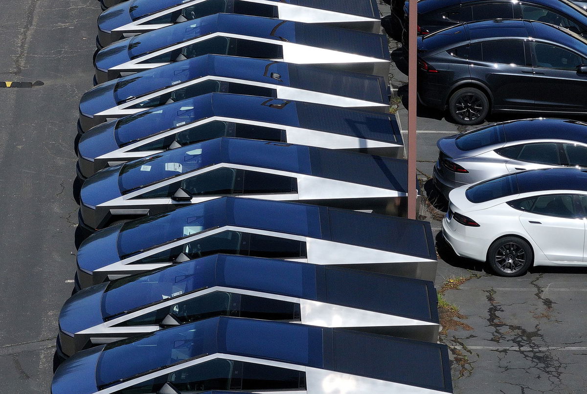 <i>Andrew Harnik/Getty Images via CNN Newsource</i><br/>President Donald Trump and Elon Musk depart after looking at Tesla vehicles on the South Lawn of the White House on March 11