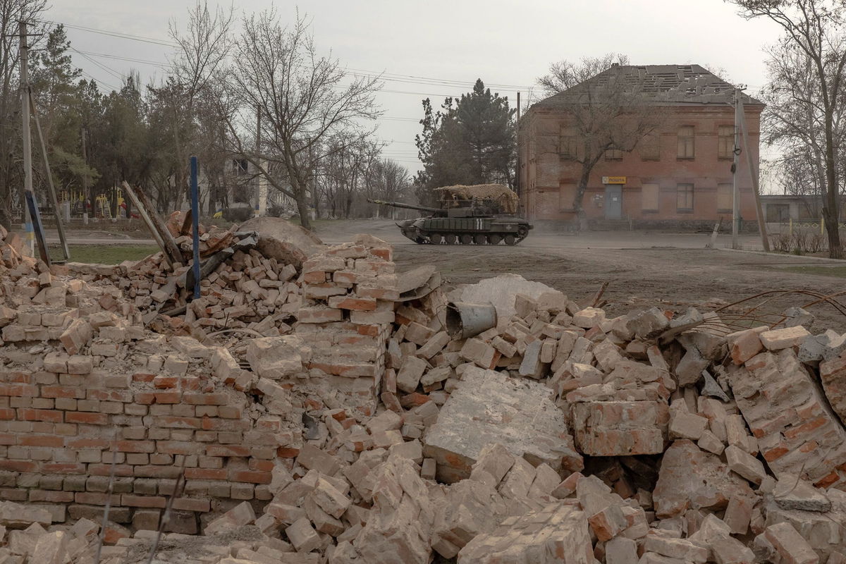 <i>Roman Pilipey/AFP/Getty Images/File via CNN Newsource</i><br/>A Ukrainian tank drives on a road past buildings damaged by shelling in a village in the Dnipropetrovsk region on March 16.