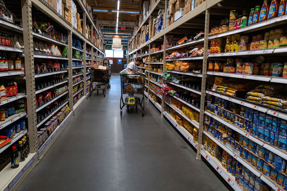 <i>Spencer Platt/Getty Images via CNN Newsource</i><br/>People shop at a grocery store in Brooklyn on May 13