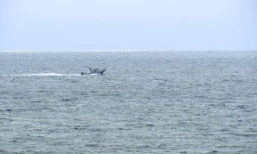 A boat searches for survivors of a plane crash near Point Loma