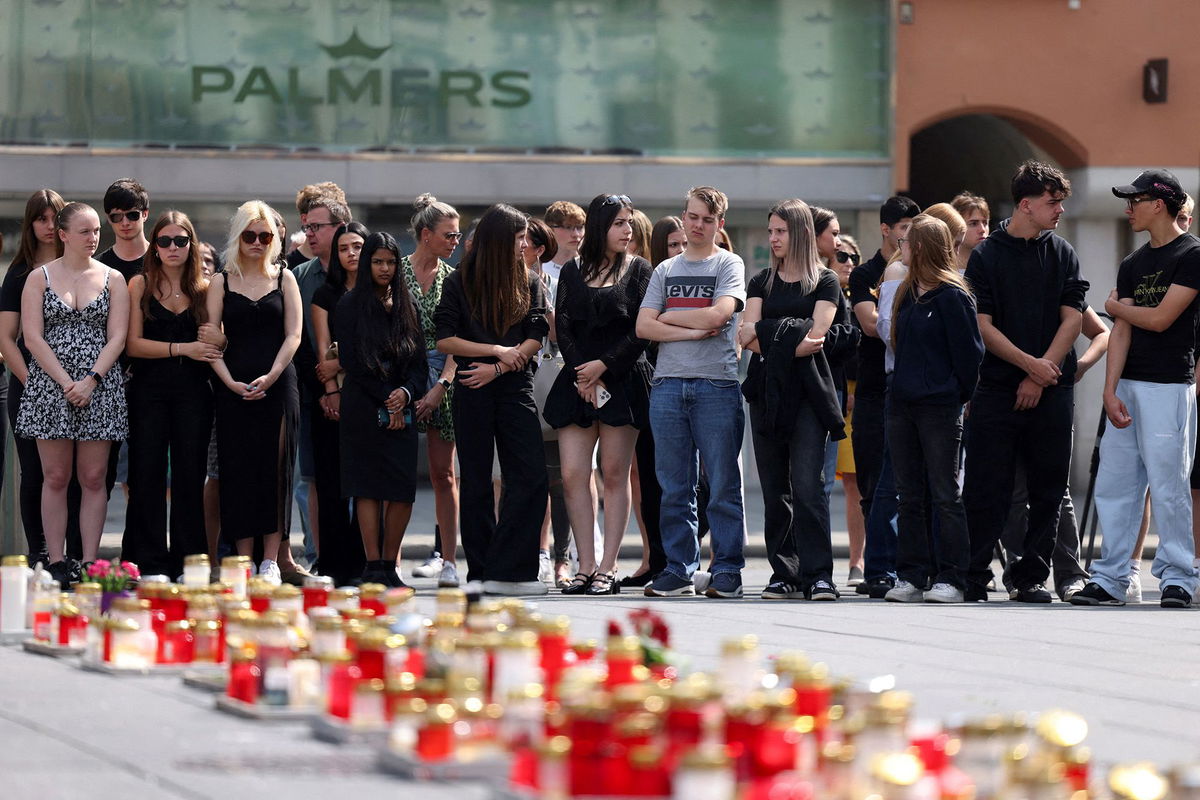 <i>Leonhard Foeger/Reuters via CNN Newsource</i><br/>Mourners gather to observe a minute of silence for the victims of the school shooting in Graz