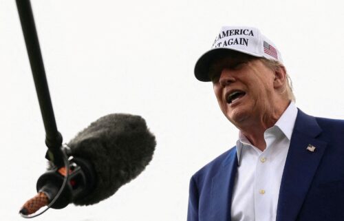 President Donald Trump speaks to members of the media during the installation of a new flagpole on the South Lawn at the White House.