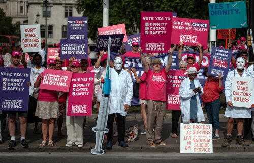 Campaigners in favor and against the bill on the streets of Westminster Friday.