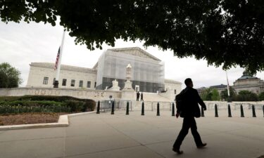 A person walks past the U.S. Supreme Court in Washington
