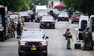 Law enforcement agents flood Minnesota state Rep. Melissa Hortman's neighborhood June 14 after she and her husband were fatally shot.
