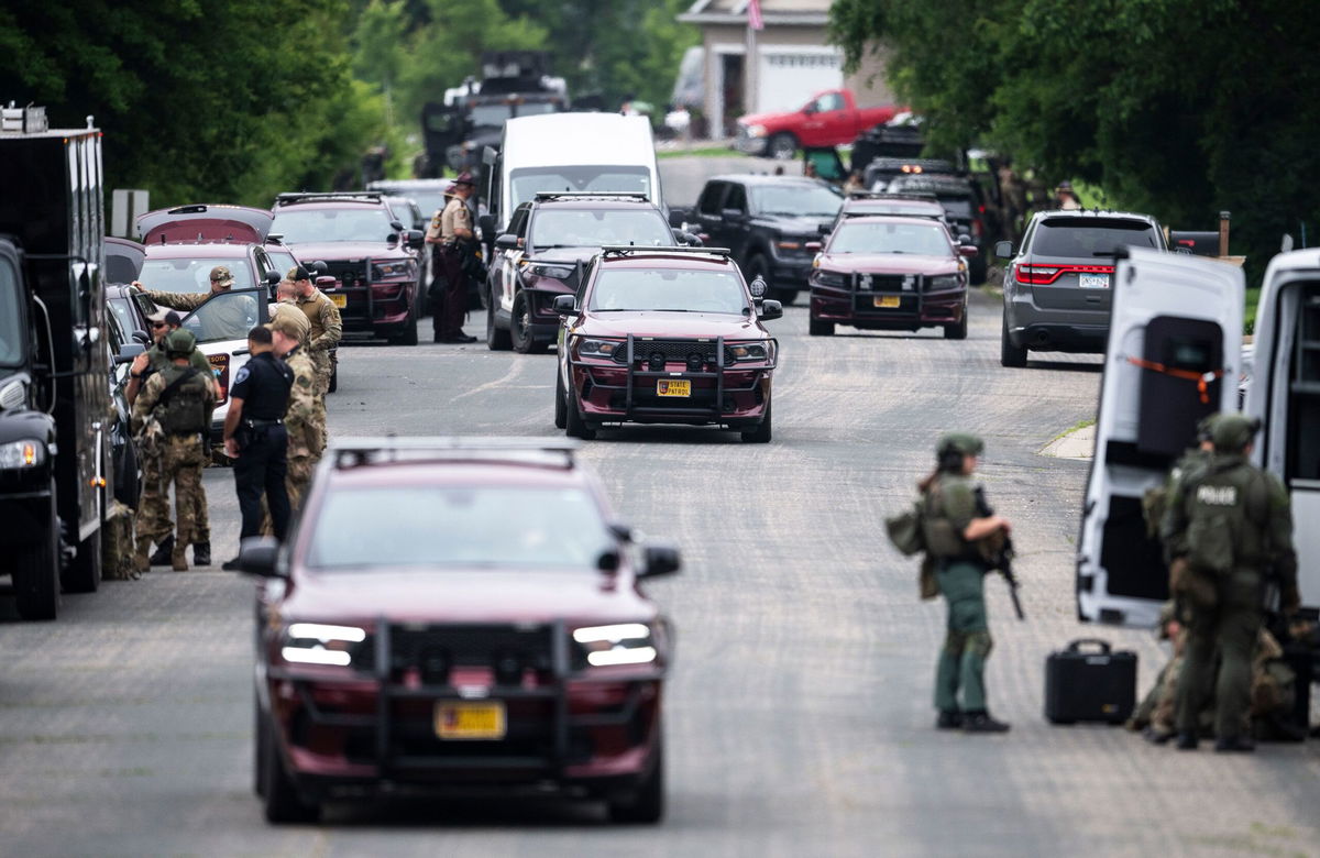 <i>Stephen Maturen/Getty Images via CNN Newsource</i><br/>Law enforcement agents flood Minnesota state Rep. Melissa Hortman's neighborhood June 14 after she and her husband were fatally shot.