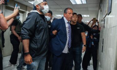 New York City Comptroller Brad Lander is placed under arrest by masked Immigration and Customs Enforcement and FBI agents outside federal immigration court on Tuesday in New York.