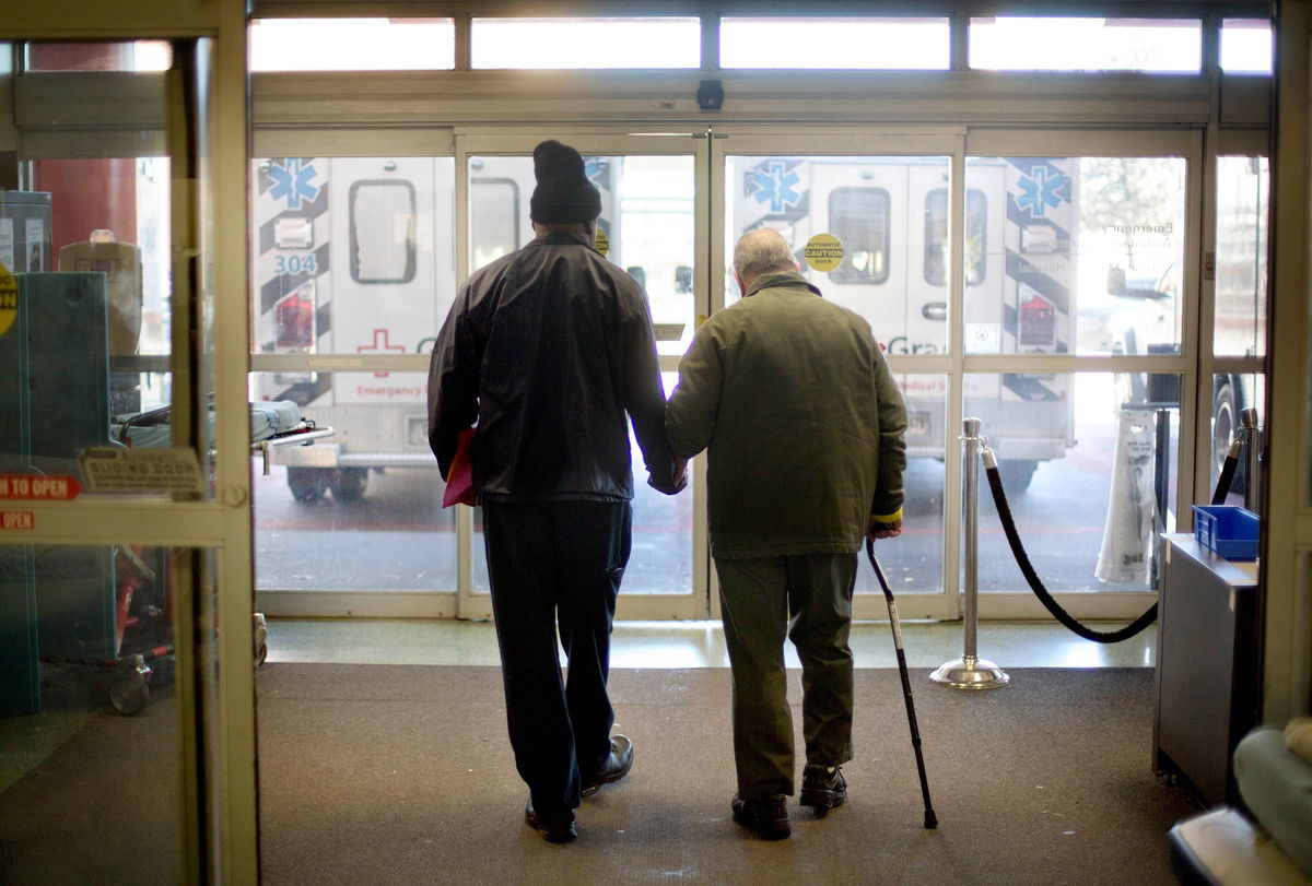 <i>David Goldman/AP via CNN Newsource</i><br/>A patient is assisted out of the emergency department at a hospital in Atlanta.