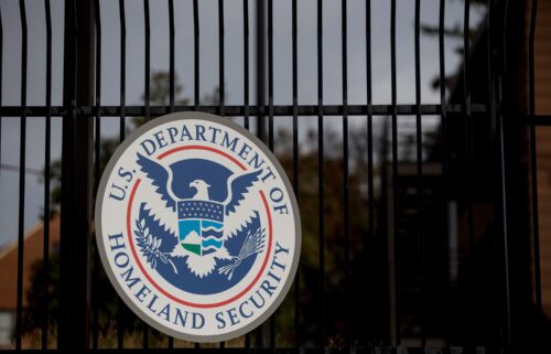 The US Department of Homeland Security (DHS) seal hangs on a fence at the agency's headquarters in Washington
