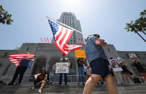Protesters rally in front of Los Angeles City Hall against military action and war in Iran on Sunday.
