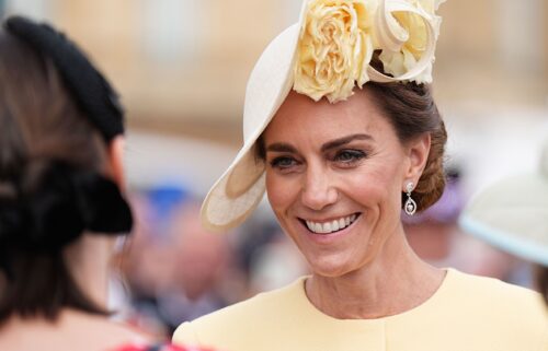 The Princess of Wales greets guests during a Royal Garden Party at Buckingham Palace on May 20 in London