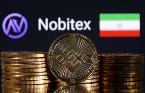 Representations of cryptocurrency Binance are seen in front of displayed Nobitex logo and Iran flag in this illustration taken in November 2022.