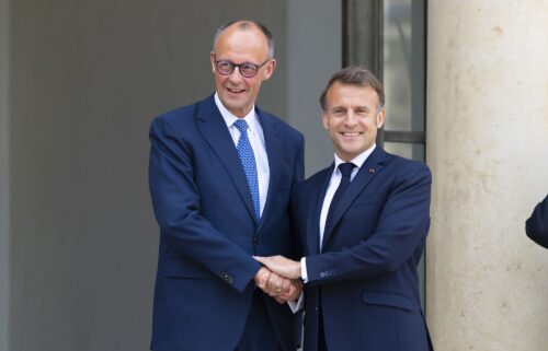 French President Emmanuel Macron speaks with Germany's Chancellor Friedrich Merz before a meeting on the sidelines of the NATO summit in The Hague