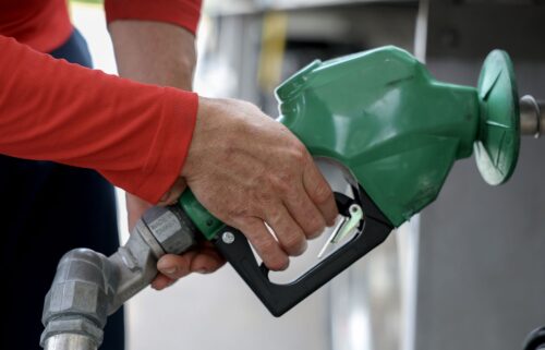 Arley Perez pumps diesel fuel into his truck at a Shell station on April 10