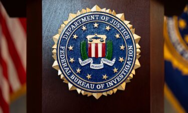 FBI seal is displayed on a podium before a news conference at the field office in Portland