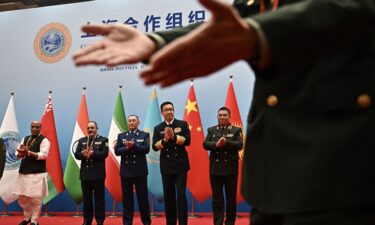Defense ministers including China's Dong Jun (second from right) gather for a group photo during the SCO defense minister's meeting on Wednesday.