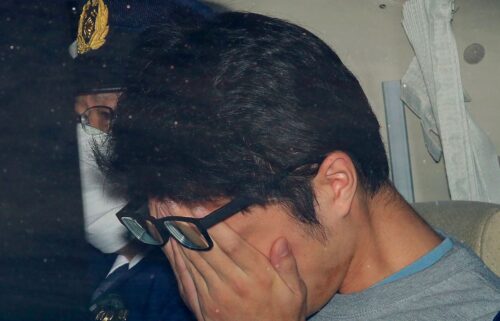 Takahiro Shiraishi leaves a police station in Hachioji