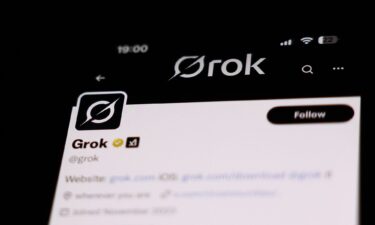 Elon Musk walks to the White House after landing in Marine One on the South Lawn with U.S. President Donald Trump (not pictured) on March 9