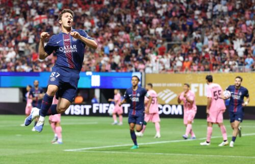Inter Miami's Lionel Messi and Paris Saint-Germain's Warren Zaire-Emery fight for the ball during the FIFA Club World Cup 2025.