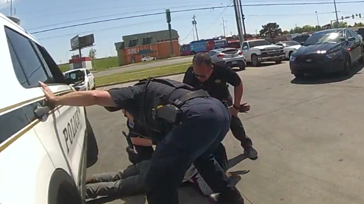 <i>Tulsa Police Department body camera video/KJRH via CNN Newsource</i><br/>2 News obtained body and dash cam footage of an April jaywalking arrest where the suspect was injured when a Tulsa police officer forgot to put his patrol car in park.