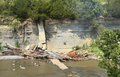 The Salina Fire Department is warning residents that they could face arson charges if attempting to remove a massive log jam by fire on the Smoky Hill River after a nearby fire over the weeken