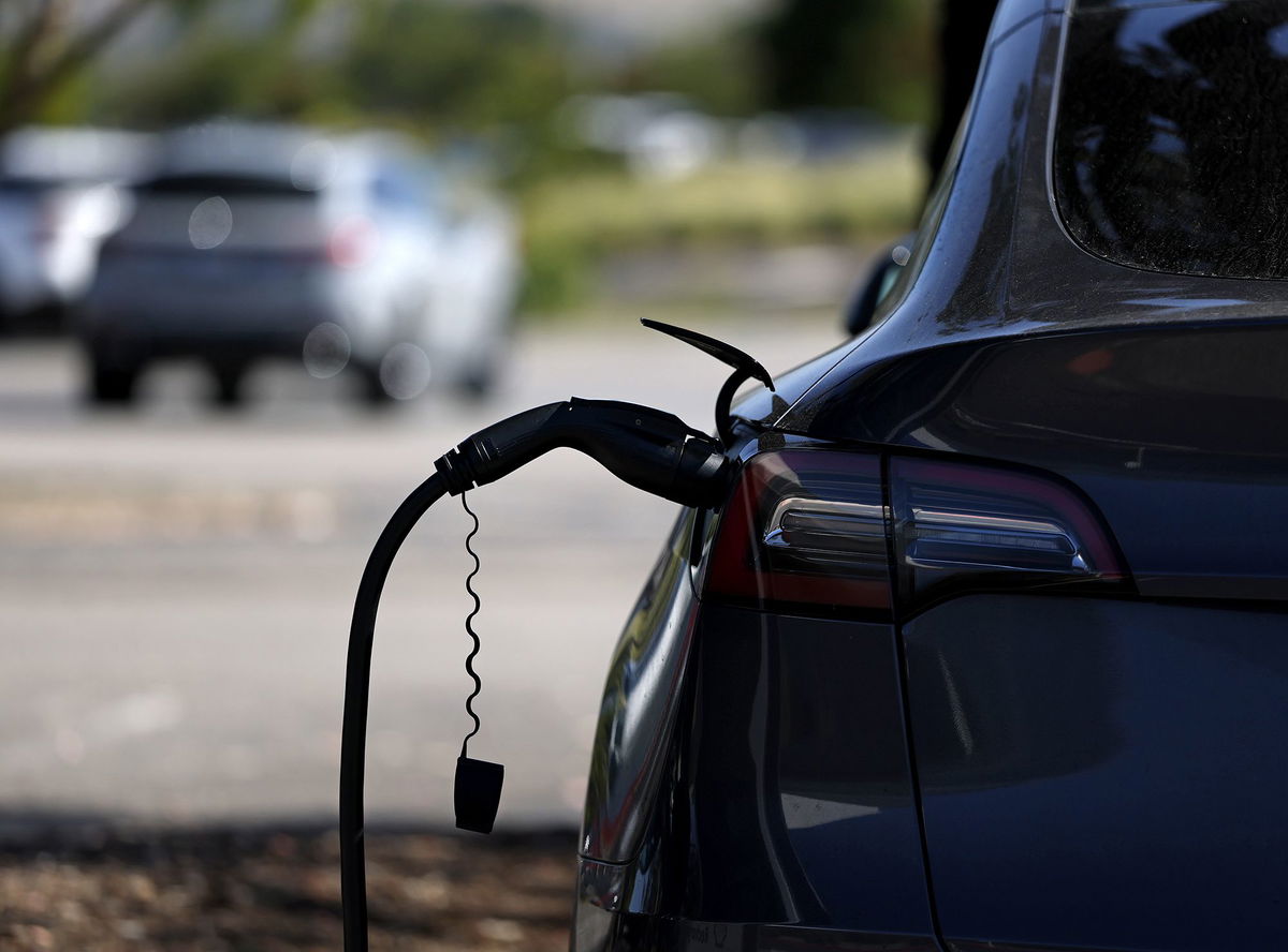 <i>STR/AFP/via Getty Images via CNN Newsource</i><br/>BYD electric cars wait to be loaded to the automobile carrier BYD