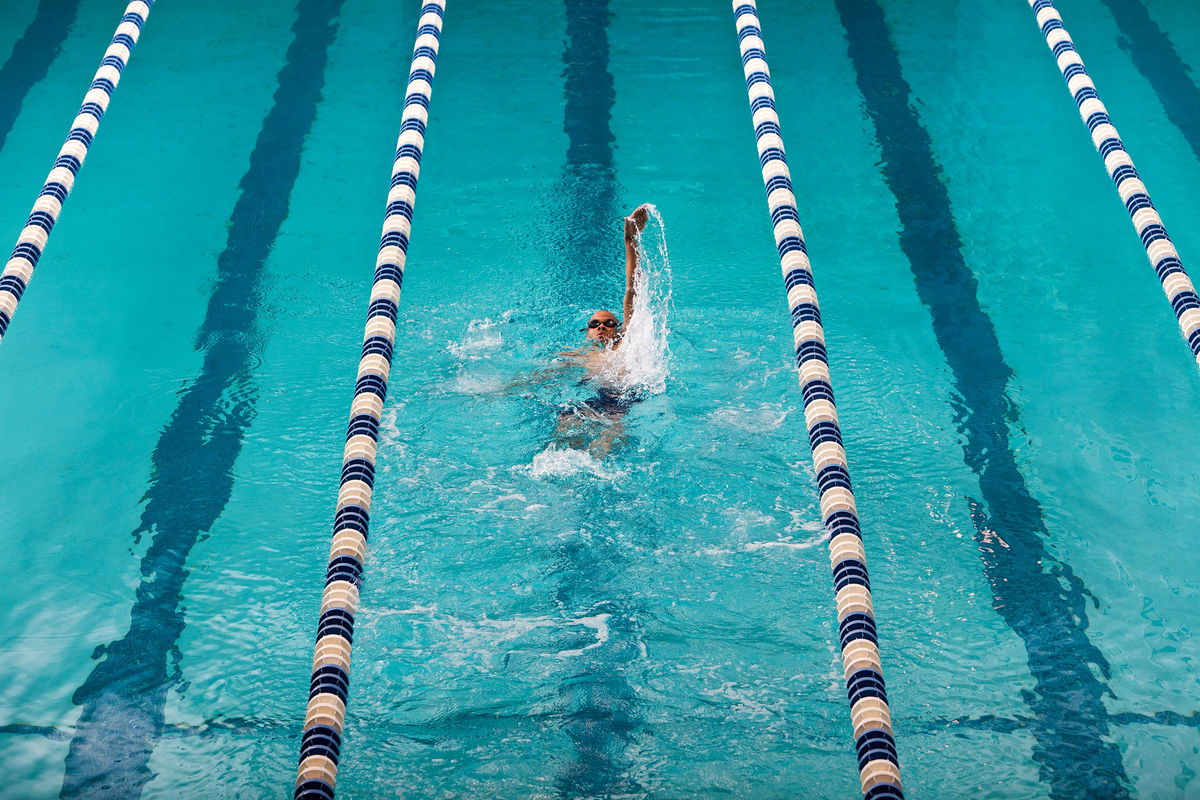 <i>Matt Henry Gunther/The Image Bank RF/Getty Images via CNN Newsource</i><br/>Adding more resistance — such as swimming against the water — can ramp up a workout.