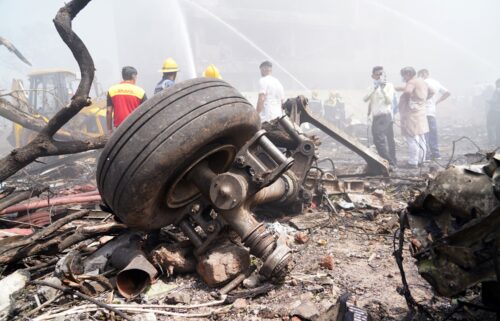 Aircraft landing gear is seen at the crash site of Air India Ltd. flight AI171 in Ahmedabad