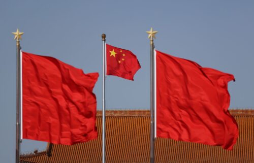 Chinese national flags flutter at Tiananmen square ahead of the annual two sessions in February 2024 in Beijing