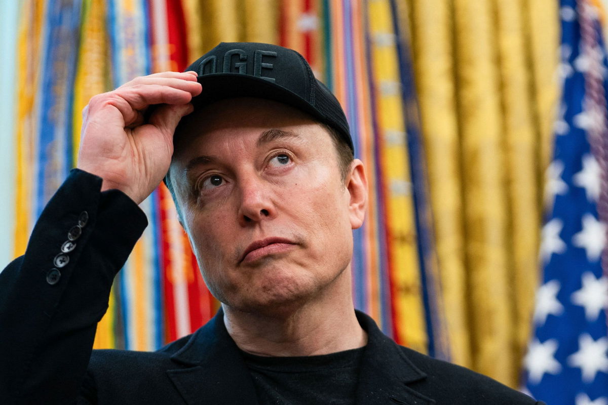 <i>Allison Robbert/AFP/Getty Images via CNN Newsource</i><br/>Elon Musk looks on during a news conference with US President Donald Trump in the Oval Office on May 30.