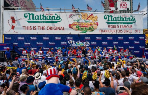 Competitors compete for the women's title at Nathan's Annual Hot Dog Eating Contest on July 4