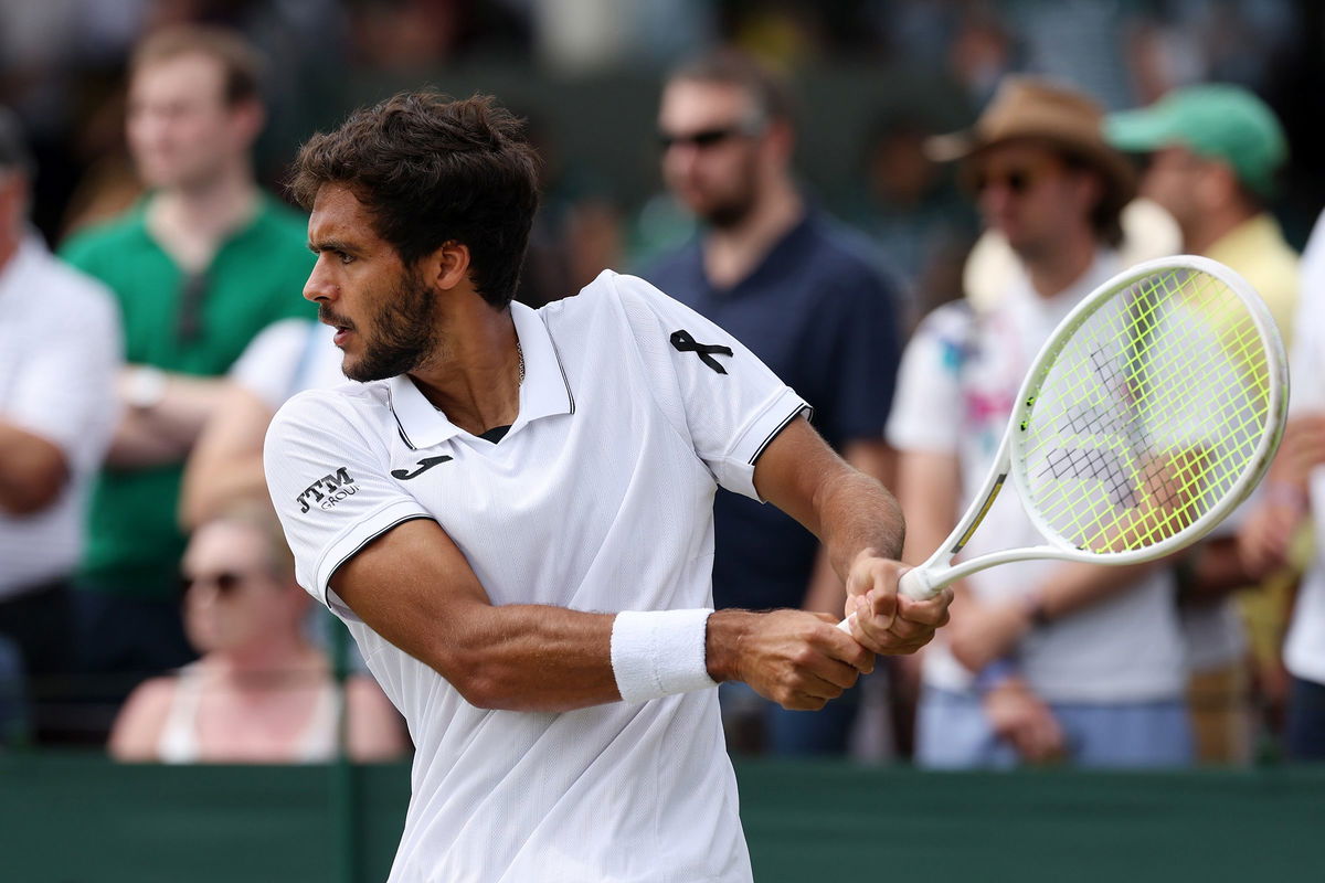 <i>Ezra Shaw/Getty Images via CNN Newsource</i><br/>A black ribbon is worn by Francisco Cabral of Portugal as he plays his men's doubles second-round match on Friday at Wimbledon.