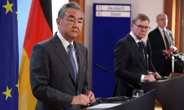 German Foreign Minister Johann Wadephul and Chinese Foreign Minister Wang Yi speak to the media following talks on July 3