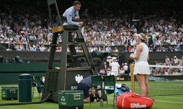 Anastasia Pavlyuchenkova (right) speaks to umpire Nico Helwerth during her match against Sonay Kartal.