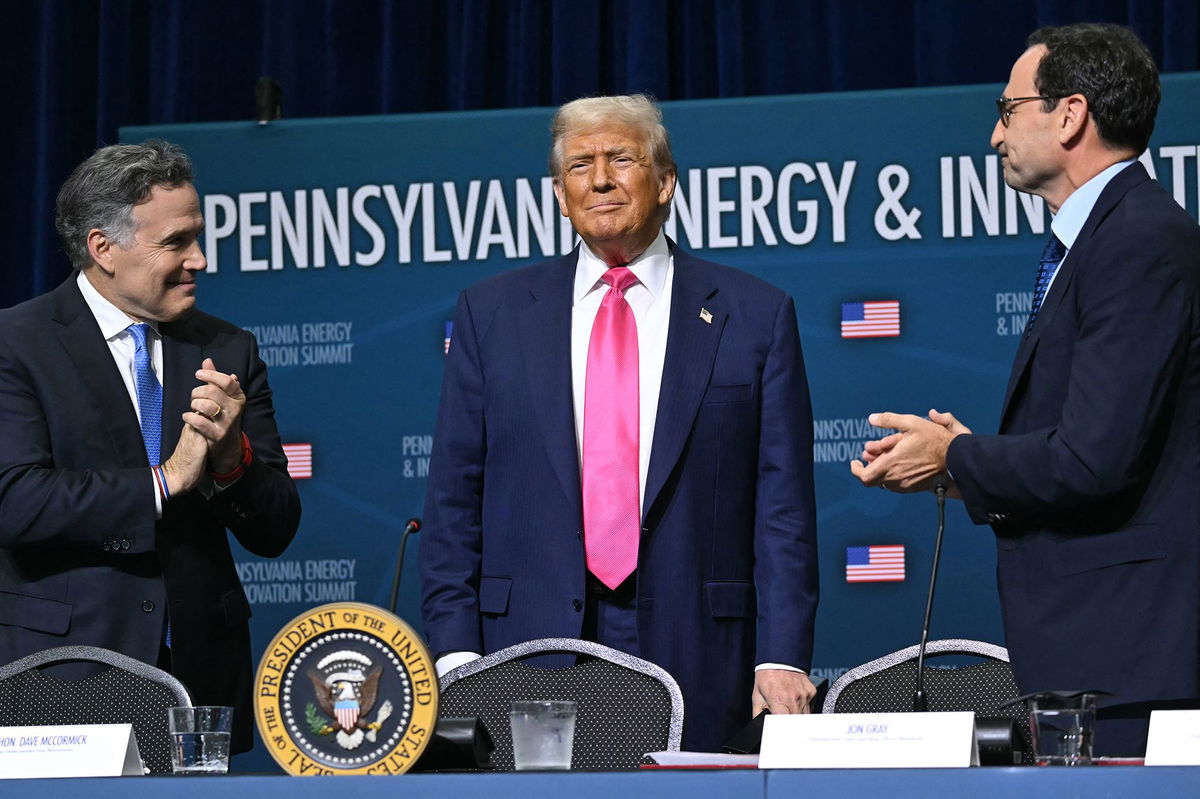 <i>Andrew Caballero-Reynolds/AFP/Getty Images via CNN Newsource</i><br/>President Donald Trump with Sen. Dave McCormick (L) and CEO of Blackstone Group Jon Gray (R) on the campus of Carnegie Mellon University in Pittsburgh on July 15.