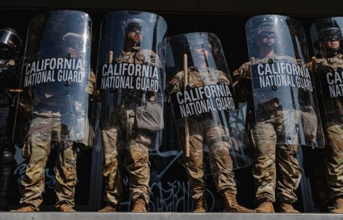 National Guardsmen stand outside of the Edward Roybal Federal Building in downtown Los Angeles