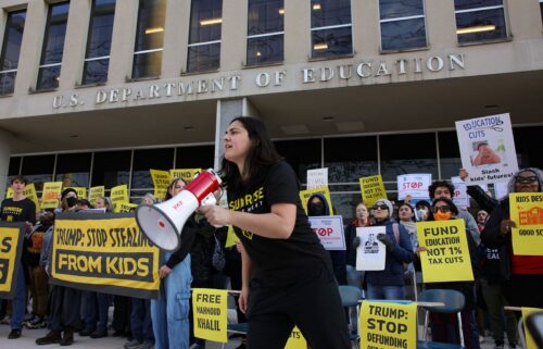 Demonstrators gather outside of the offices of the U.S. Department of Education in Washington