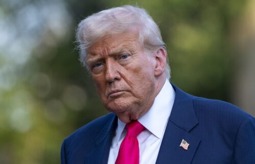 President Donald Trump walks from Marine One after arriving on the South Lawn of the White House