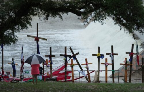 Rain falls over a makeshift memorial for flood victims along the Guadalupe River on July 13 in Kerrville